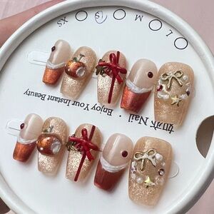 Festive Nail Art Set with Red and Gold Accents